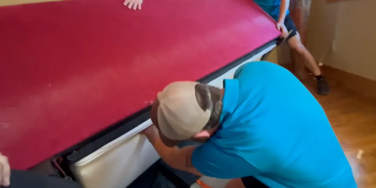 Professional movers handling furniture with care